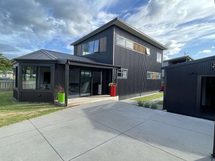 A three-bedroom, two-bathroom bach on Vista Paku, in Pauanui, received multiple offers after a busy open at the weekend. Photo / Supplied