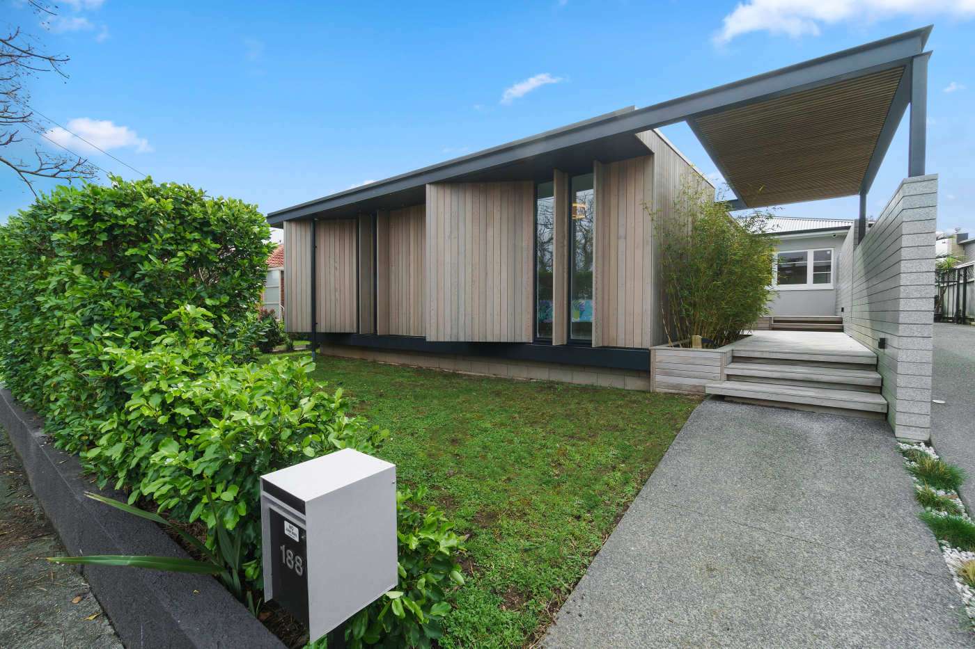 aerial view of white house with curves and cedar trim  80 Alfred Street, Onehunga, Auckland