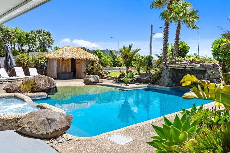 The leaky home at 4 Sandhurst Drive, in Papamoa, needs to be pulled down and a new built on the large corner section across the road from Papamoa Beach. Photo / Supplied