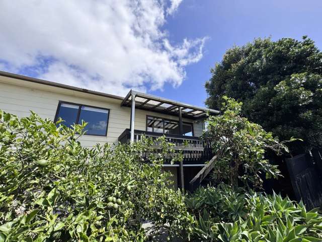 Elevated 3-Bedroom Home with Sunny Wraparound Deck