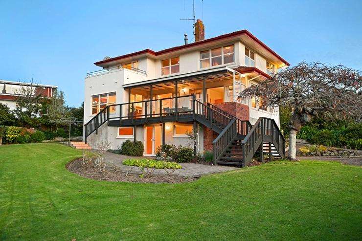 A five-bedroom home on 8160sqm with a pool and tennis court is one of the three properties overlooking Hamilton Lake for sale. Photo / Supplied