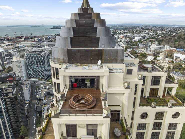 The Batman logo looms large in the luxury apartment at the top of the Metropolis tower in Auckland Central. Photo / Supplied