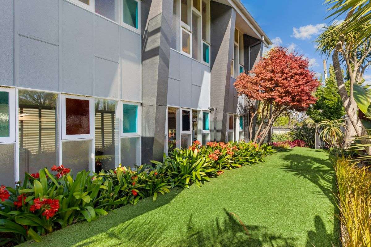 The former Baptist church on Sylvia Road, in Glendowie, Auckland, was transformed into a family home. The church steeple can be seen on the lawn. Photo / Supplied