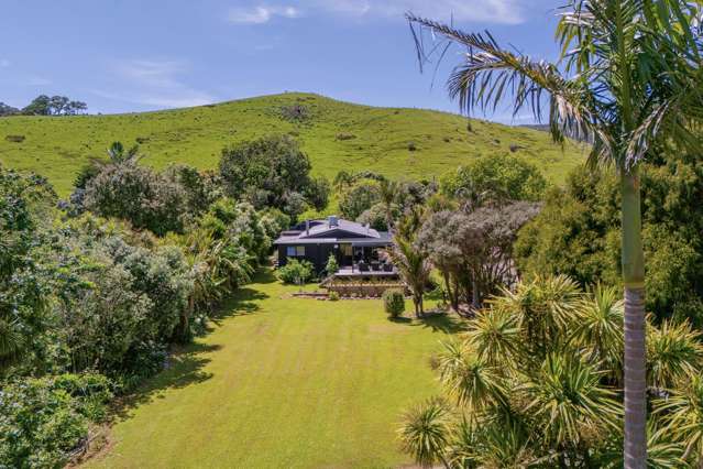 Lush Coastal Oasis with Dual Living on One Acre