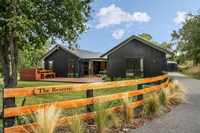 Sleek home with a forest backdrop