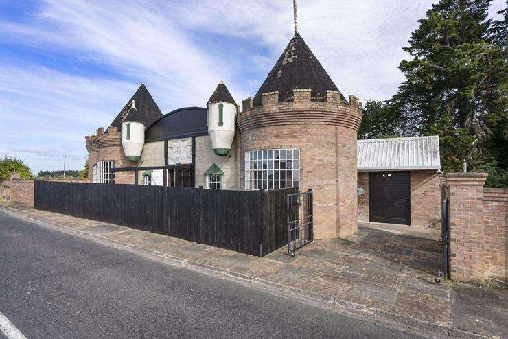 Iconic roadside castle up for grabs on Auckland’s border