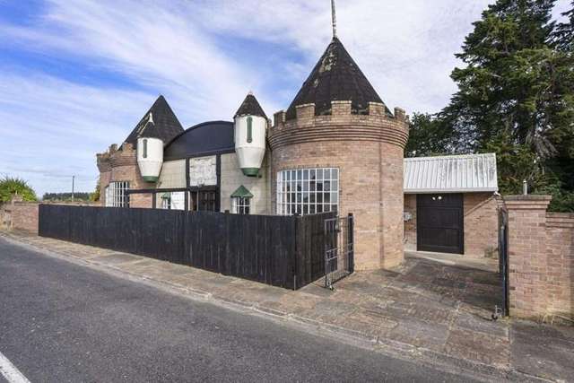 ‘A true local legend’: Iconic roadside castle up for grabs on Auckland’s border