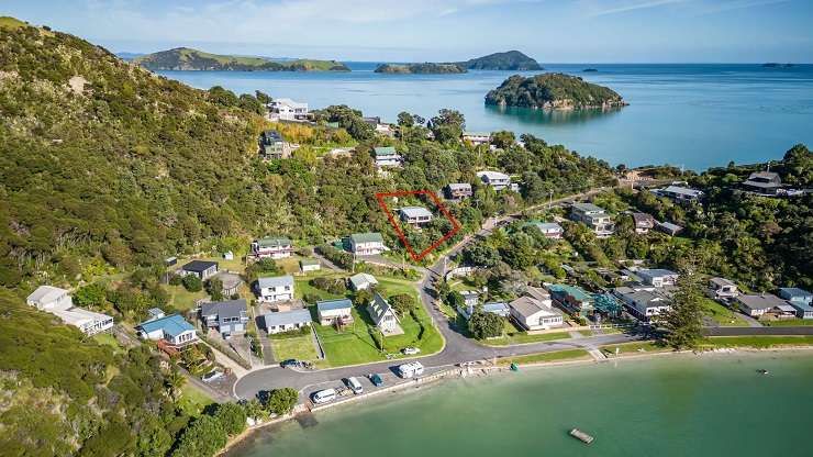 The bach is the first waterfront property to sell in Te Kouma in a decade. Photo / Supplied