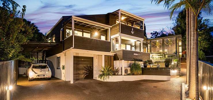 A four-bedroom house on Law Street, in Torbay, Auckland's North Shore, sold under the hammer for <img.566 million. Photo / Supplied