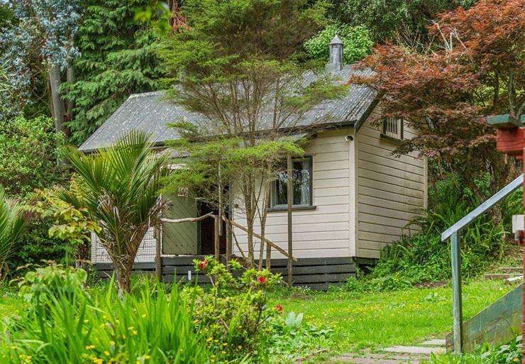 A rustic three-bedroom home with an old jail house on its Kotuku Road property, in Te Aroha, sold under the hammer this week. Photo / Supplied