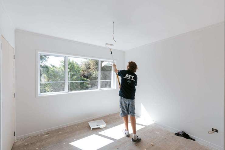 Eleven students from Trident High School, in Whakatāne, have spent the last eight months renovating an old smoko house. Pictured is tutor Hamish Galloway with some of the students. Photo / Boundless Vision and The Northern Group