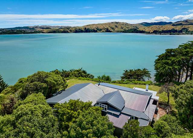 Asbestos-clad bach in Porirua sells for $2.1m - double its RV