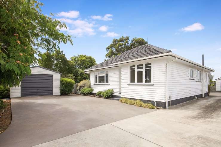 A three-bedroom bungalow on Hills Road, in Mairehau, had 11 offers presented within three weeks of going on the market. Photo / Supplied