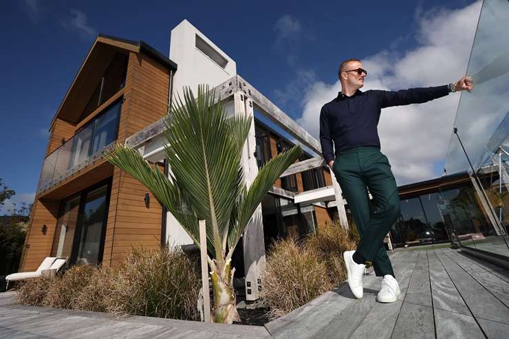 Barfoot & Thompson agent Paul Neshausen is wearing a Dolce & Gabbana sequin suit, a Versace shirt and Gucci shoes. Photo / Fiona Goodall