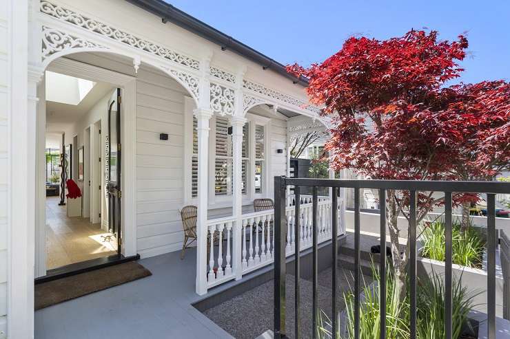 The owners of a stylish villa in Auckland's Ponsonby put their own spin on the sold sticker adorning the real estate sign outside their house. Photo / Supplied