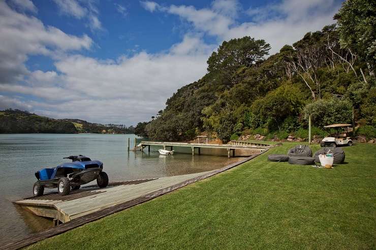 white pavilion house with glass roof and infinity pool  729 Orapiu Road, Omaru Bay, Waiheke Island Auckland