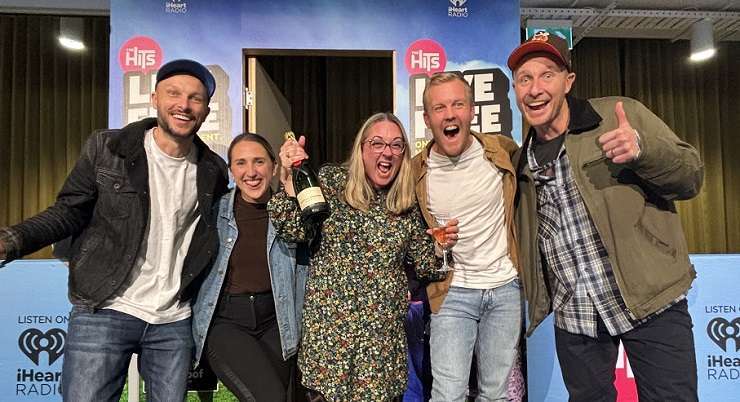 The Hits Drive time host Matty McLean congratulates Christchurch homeowner Shona Robertson on her win. Photo / Supplied