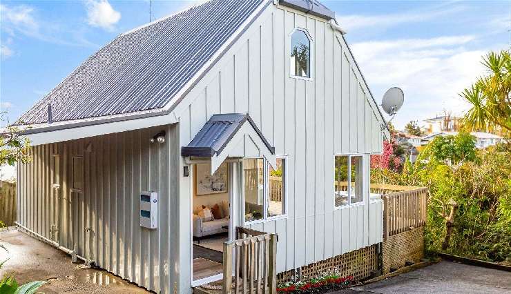 How the three-bedroom house at Aeroview Drive, in Beach Haven, Auckland, looked when it was picked up by trader Mark Trafford in April. Photo / Supplied