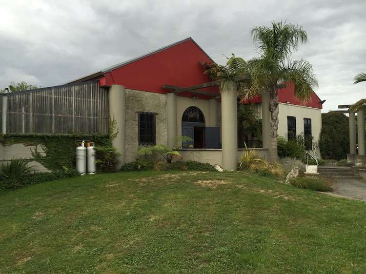 The five-bedroom, four-bathroom home at 10 Riverpoint Road, in Matawhero, started its life as the Colosseum Restaurant and Bar, which was set up by wine legend Denis Irwin. Photo / Supplied