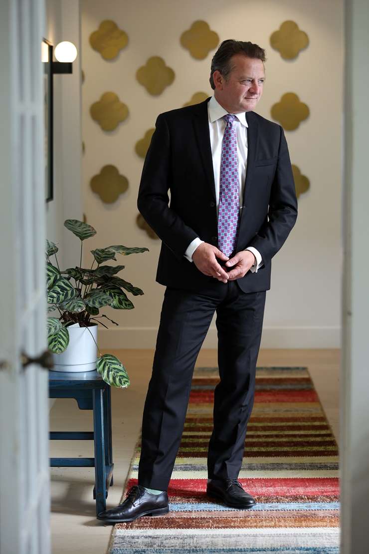 Barfoot & Thompson agent Paul Neshausen is wearing a Dolce & Gabbana sequin suit, a Versace shirt and Gucci shoes. Photo / Fiona Goodall