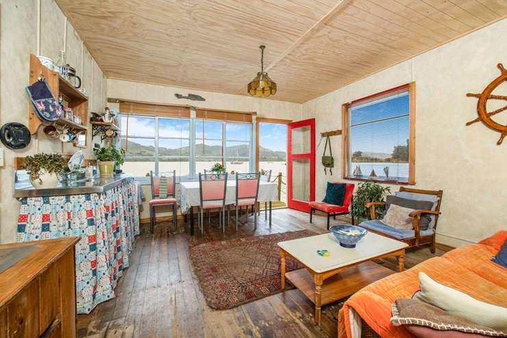 The brightly painted boatshed at 6083 Portobello Road, in Broad Bay, Dunedin, is one of the harbour's most photogenic. Photo / Supplied