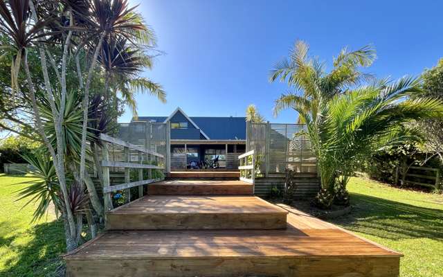 This property features four bedrooms and is located near the beach, with a large back section leading onto the harbor!