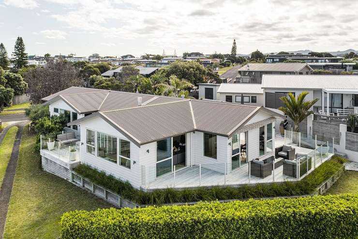 Two families joined together to buy a three-bedroom home on Meiklejohn Way, in Omaha, with the sale price well above the property's <img.25m CV. Photo / Supplied