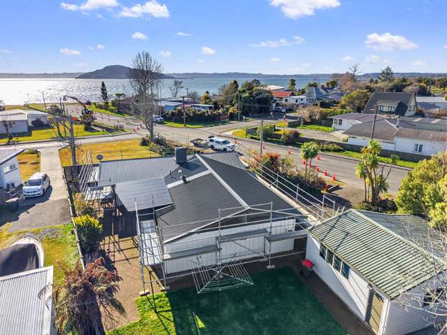 New Roof, Lake Views & Quarter-Acre Potential!
