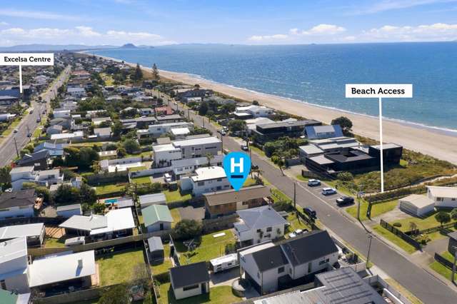 Two homes. One title. Beach across the road.