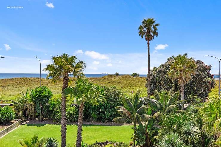 The leaky home at 4 Sandhurst Drive, in Papamoa, needs to be pulled down and a new built on the large corner section across the road from Papamoa Beach. Photo / Supplied