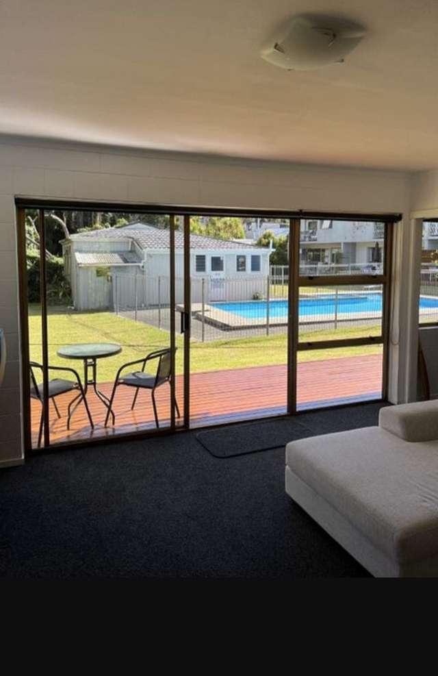 Sunny and safe unit with pool and garden