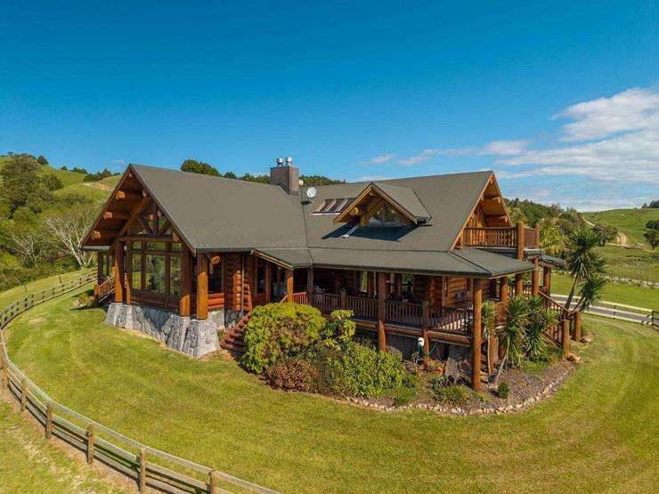 A six-bedroom log home built in Canada and now located in Ōkaihau in the Far North has an asking price of $2.55m. Photo / Supplied