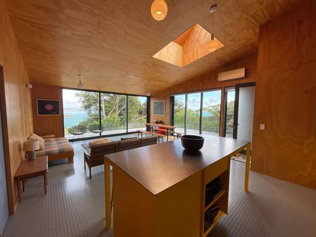 A Glass Sanctuary in the Trees – Rocky Bay Retreat