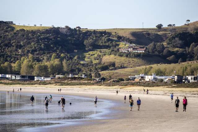 Rich Kiwis stockpiling baches in NZ's poshest beach town