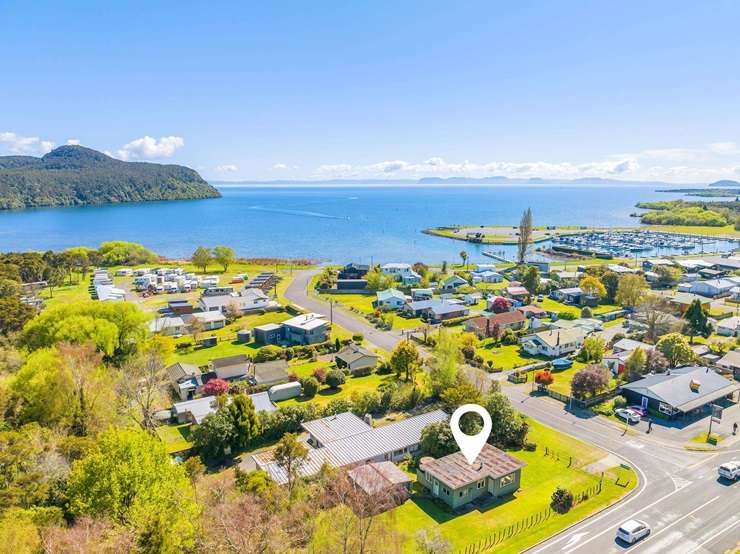 The 1950s basic three-bedroom bach for sale at 1 Parekarangaranga Street, in Motuoapa. Photo / Supplied