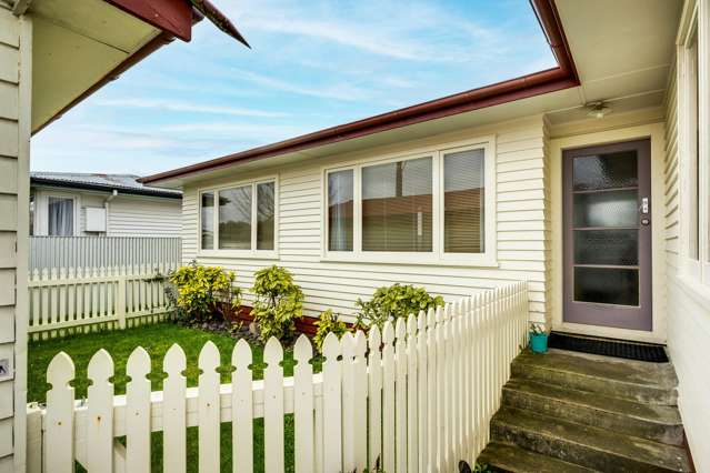 Solid, freehold family home with a lined garage