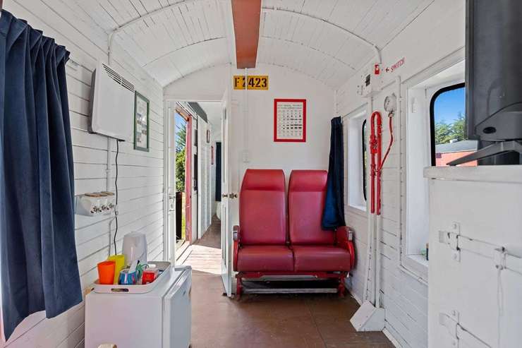 A renovated 1950s home and a quirky train accommodation business, Waipara Sleepers, is seeking buyer enquiry over $995,000. Photo / Supplied