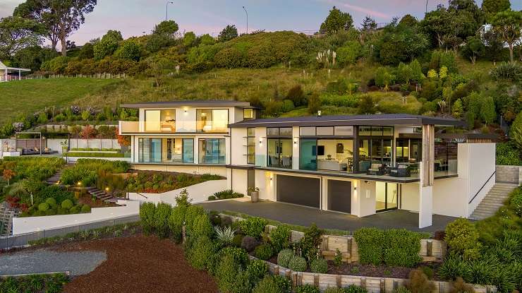 This luxury home on Paritai Drive, in Auckland's Orakei, sold off market for $20m this year. Photo / Supplied