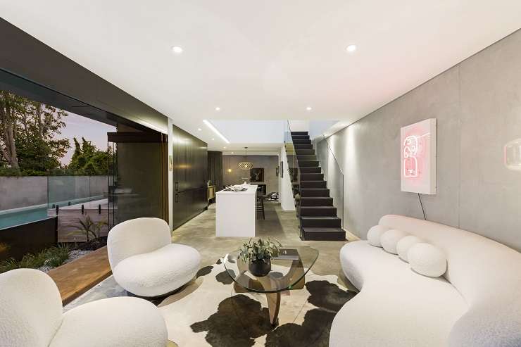 The striking black home on Mainston Road, in Remuera, was one of the first residential properties built using materials traditionally found in commercial builds. Photo / Supplied