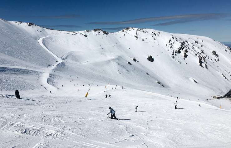 Man on top of mountain peak in Methven