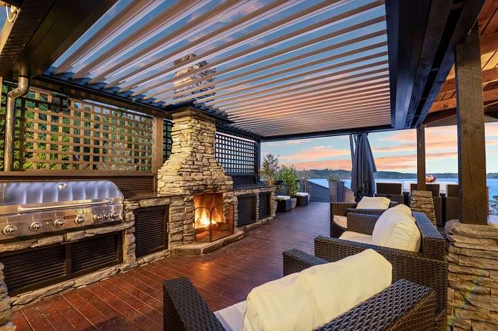 cedar house with lights and decks in foreground 257A Whangamoa Drive, Lake Rotoiti, Rotorua