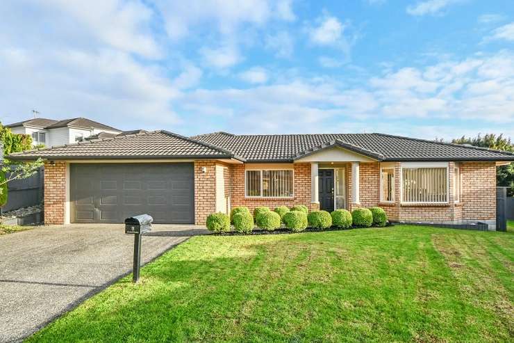 This fire-damaged home at 26a Gray Avenue, in Mangere East, Auckland, is one of 60 properties on the block at a mega auction event. Photo / Supplied