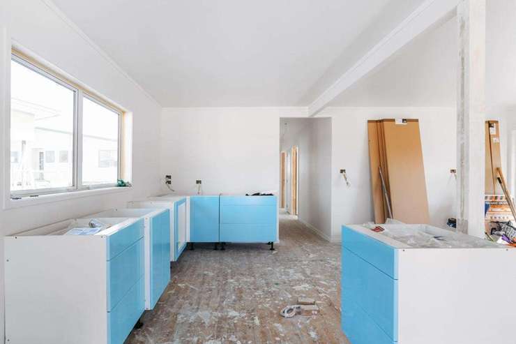Eleven students from Trident High School, in Whakatāne, have spent the last eight months renovating an old smoko house. Pictured is tutor Hamish Galloway with some of the students. Photo / Boundless Vision and The Northern Group