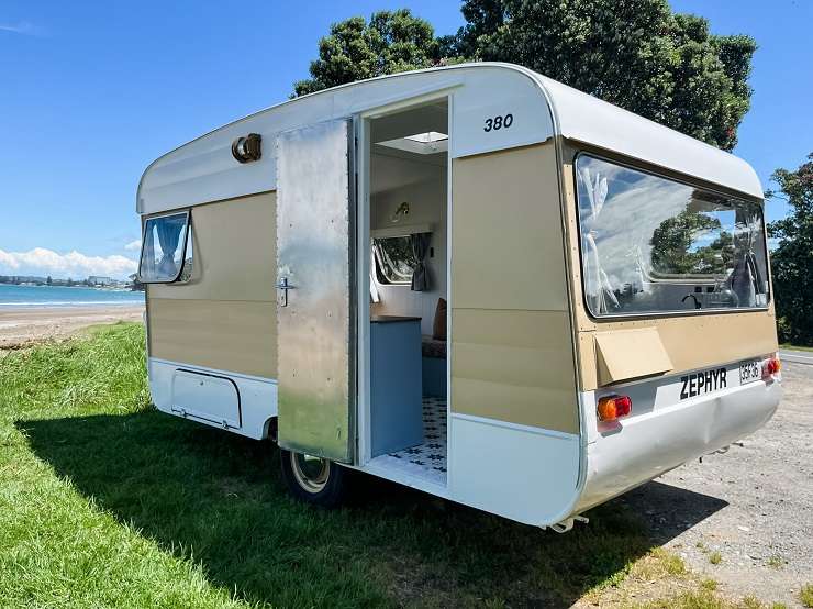 The Block stars Alice and Caleb Pearson in the 1980s Zephyr caravan they waved goodbye to at the weekend. Photo / Supplied