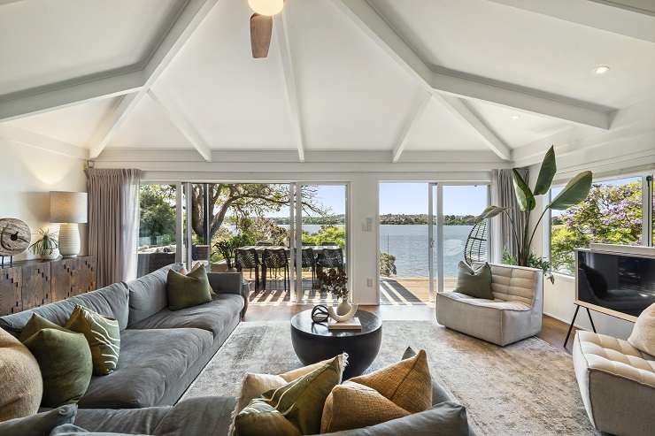 The waterfront home on Lake Pupuke sold for $4.705m - the highest sale at Harcourts Cooper & Co’s mega auction. Photo / Supplied