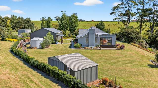Coastal acre lifestyle, with serious garage space!