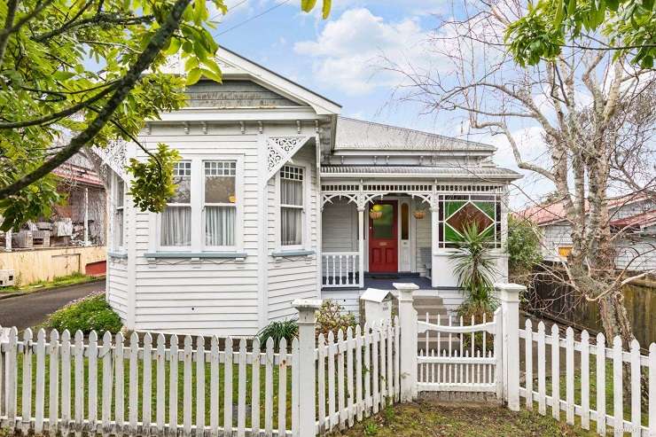 beige 1950s house with tile roof and green lawn  105 Parau Street, Mount Eden, Auckland