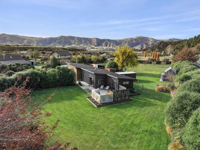 Manicured acreage with home and income