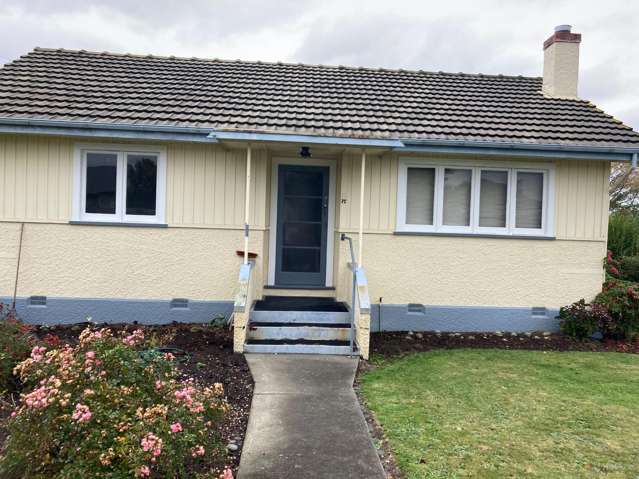 Charming 2-Bedroom Cottage with Spacious Section & Garage
