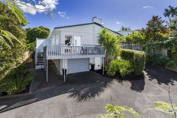 A four-bedroom house on Law Street, in Torbay, Auckland's North Shore, sold under the hammer for <img.566 million. Photo / Supplied